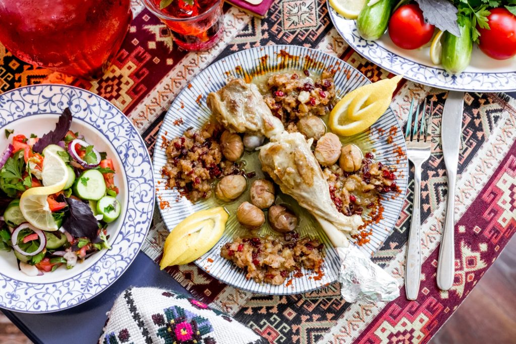 tourists enjoying local food on a traditional restaurant in Cyprus